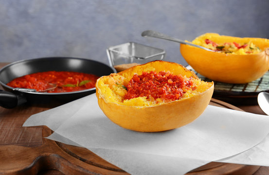 Half Of Stuffed Spaghetti Squash On Table