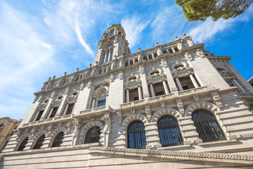 Fototapeta premium Prospective view of Porto City Hall or Camara Municipal do Porto in Avenida dos Aliados, Liberty square, Oporto in Portugal. Sunny day in the blue sky.