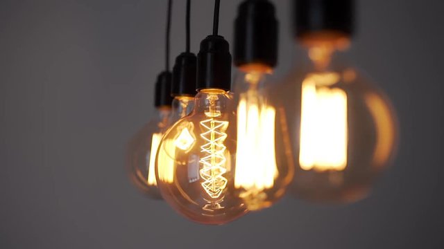 Edison lamp is glowing, electric bulb, turning the lights on, electric light, incandescent lamp, hot spiral of tungsten bulb
