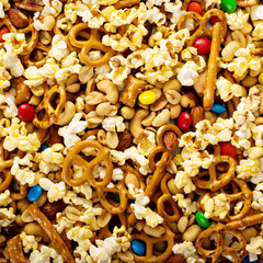Homemade trail mix with chocolate candy, popcorn, pretzels and nuts