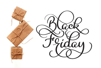Black Friday calligraphy text on white background and gifts. Hand written