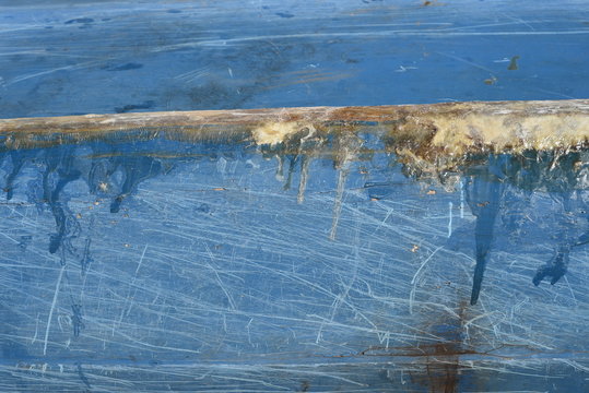 Fiberglass Crack Repair On A Blue Boat Hull