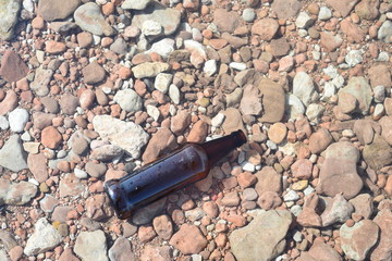 Brown Glass Bottle Floating in Water