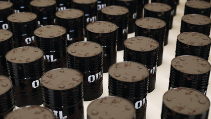 Uniformly packed grid of black oil barrels under neutral studio lighting.