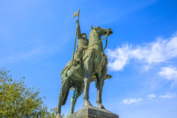 Bottom view of equestrian statue of Vimara Peres in Historic Centre of Porto, Portugal in a sunny day. The statue is located near Cathedral of Oporto or Se do Porto.