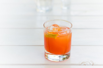 Campari juice cocktail with lemon
