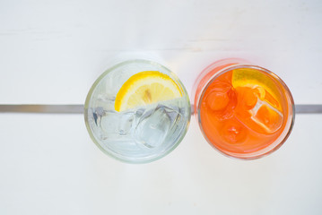 Campari juice and gin tonic cocktails with lemon