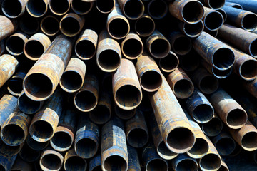 Metal Tubes Stacked in Row Pattern