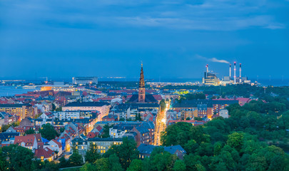 Unique cityscape of Copenhagen, skyline of industrial and habitated zone in the evening