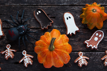 Happy Halloween card.  Funny delicious ginger cookie, bag of sweets and candies  shape ghost and skeleton with pumpkins and sweets.  