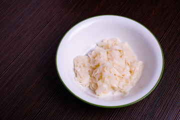 Kuey teow in a white bowl on the table