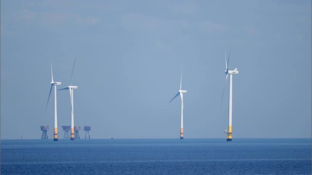 offshore wind turbines producing clean renewable energy in the north sea, kent, uk