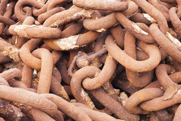 Rows of rusted chains against a background