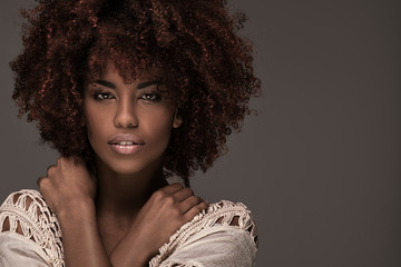Beautiful woman with afro hairstyle posing. - obrazy, fototapety, plakaty