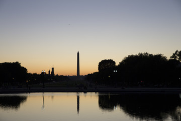 Fototapeta na wymiar Sun set behind the Washington Monument on the National Mall in Washington District of Columbia