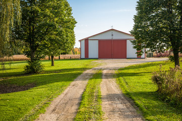 dirt road and a barn