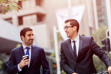 Young businessmen with a bike