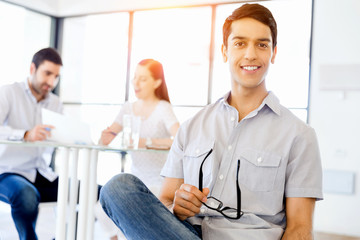 Young man in casual in office