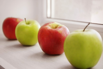 Fresh apples on windowsill