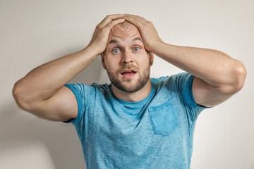 Emotional man on light background