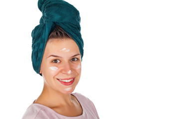 Facial moisturizer on happy woman