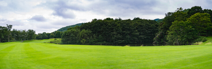 Fototapeta na wymiar Golf Course where the turf is beautiful and green in Hokkaido, Japan. Golf is a sport to play on the turf