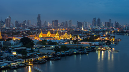 Wat Phra Kaew, Temple of the Emerald Buddha beside Chao Phraya river at twilight in Bangkok, Thailand