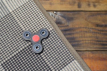 Popular finger spinner device. Modern fidget spinning toy on bearings. Spin it in hands & learn...
