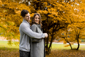 Fototapeta premium Lovely young couple in the autumn forest
