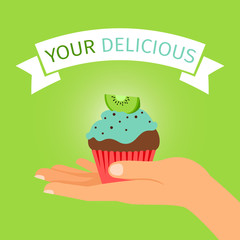 Hand holding kiwi cupcake gift
