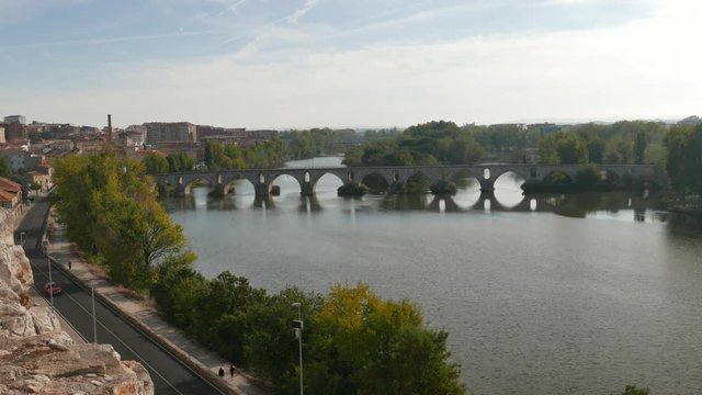 view of the Douro River and the medieval bridge in Zamora, Spain