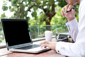 businessman working out of office near natural