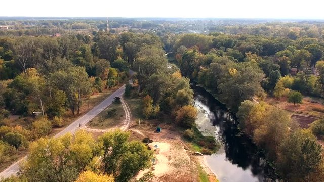 Aerial view on autumn river in Eastern Europe. Old style color grading.