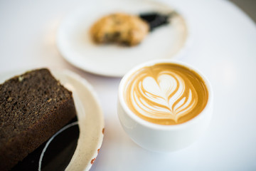 Beautiful Latte with a treat sweet
