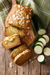 Sliced zucchini bread with almonds close-up. Vertical top view