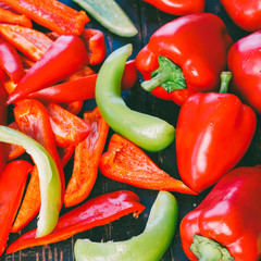 whole and sliced red and green bell pepper close-up