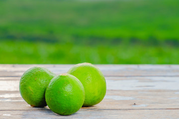 Limes  on old wooden with blurred background ,healthy nutrition,strengthening immunity and diet