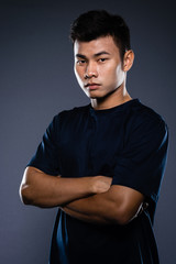 Portrait studio of a young handsome asian man
