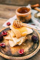 russian pancakes and ingredients on wooden background