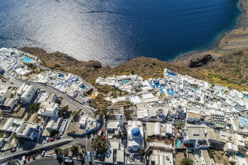 Fototapeta na wymiar Aerial view of white buildings on the cliff in Santorini Island, Greece