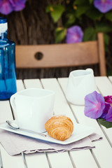 Delicious croissants with cup of coffee