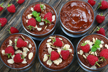chocolate mousse in cups on table
