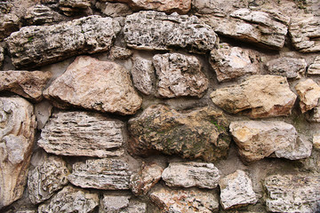 Texture of old stones and cobblestones of coral origin