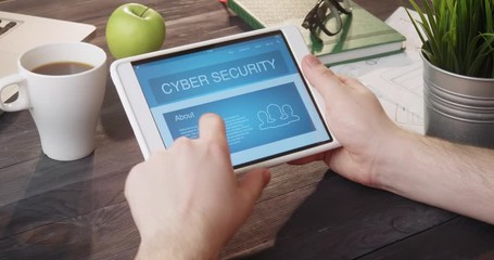 Looking at cyber security app using portable computer at desk