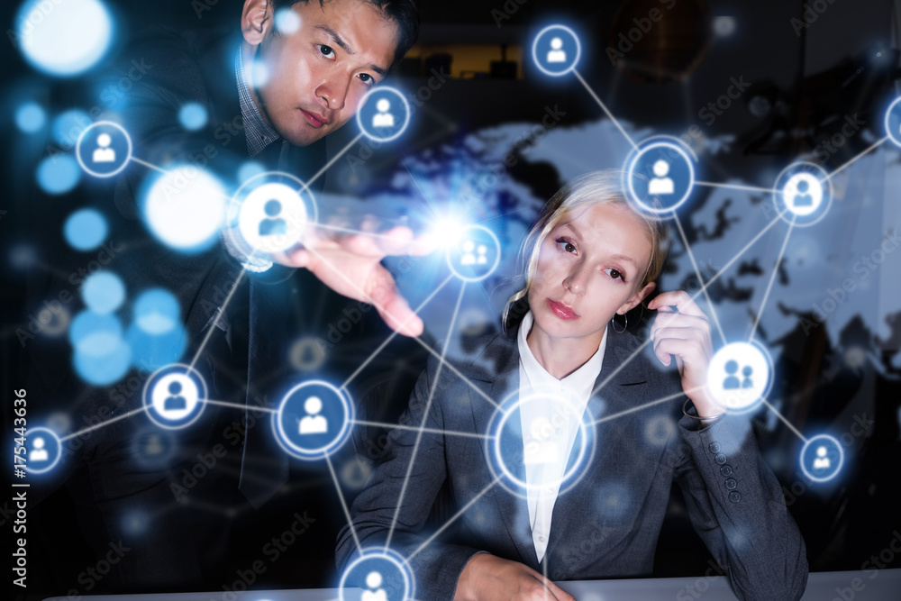 Poster two business persons in front of futuristic display. social networking concept.
