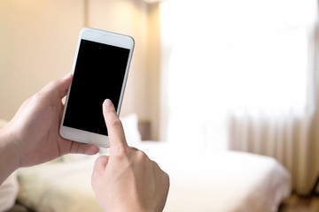 smartphone in bedroom hand touch empty screen.