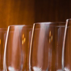 Catering, party concept: wine glasses on a wooden background. Selective focus.