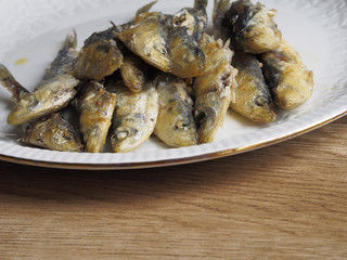 Fried small sardine on a plate