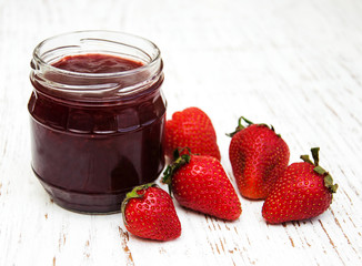 Strawberry jam and fresh strawberries