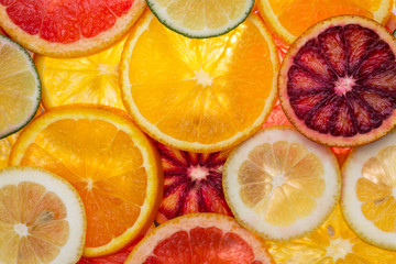 sliced mixed citrus fruits, close-up